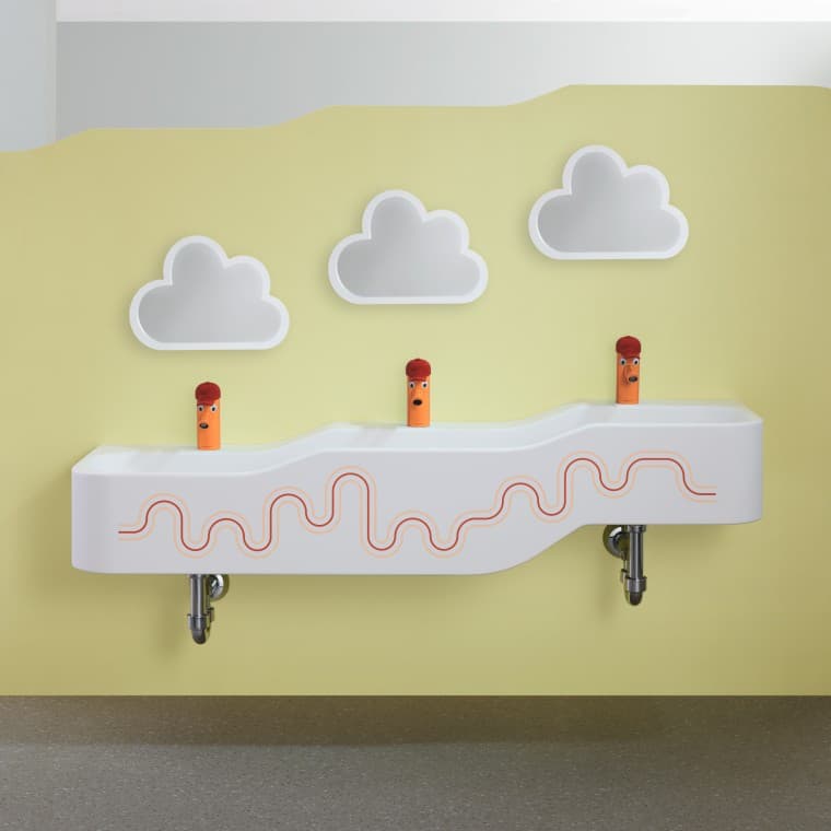 Geberit Bambini speel- en wasruimte in karmijnrood en oranje Geberit Bambini speel- en wasruimte in karmijnrood en oranje