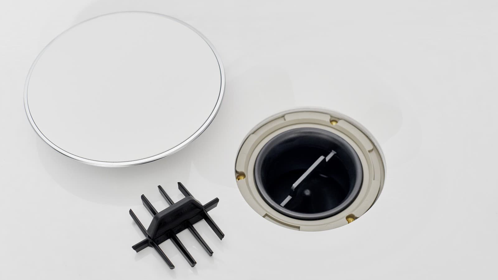 Afvoerdeksel en kam-inzetstuk Afvoerdeksel en kam-inzetstuk