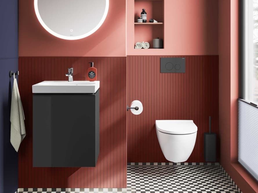 Gastentoilet in warme terracottatinten, ingericht met producten uit de Geberit Acanto badkamercollectie. Gastentoilet in warme terracottatinten, ingericht met producten uit de Geberit Acanto badkamercollectie.